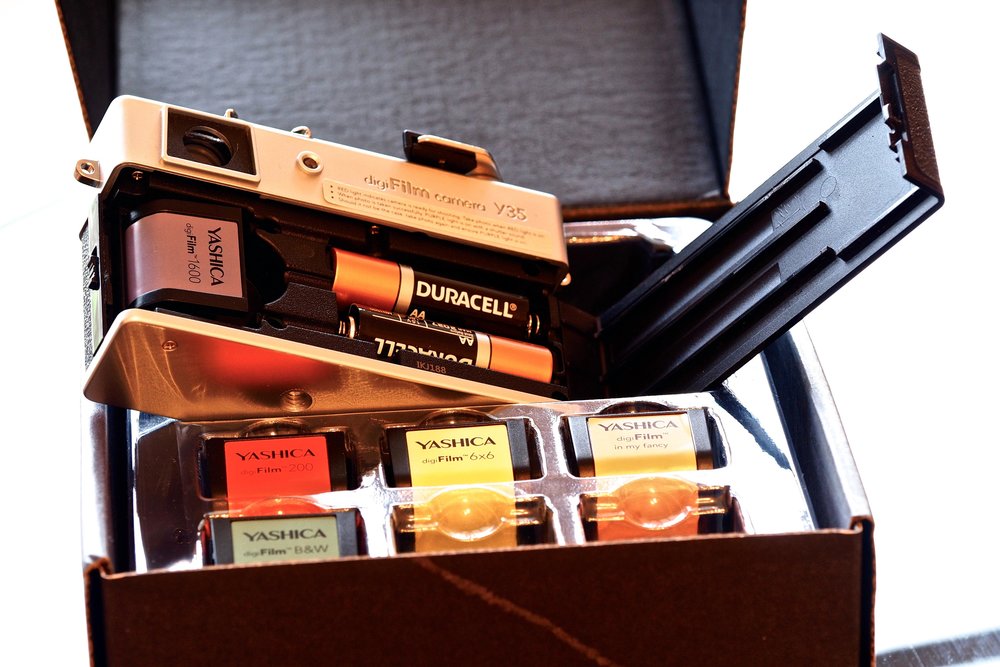 Open the back and slot in 2 AA cells and a ‘digiFilm’ cartridge.
